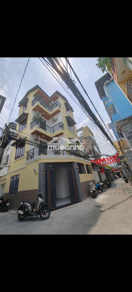 Nhà 4 tầng góc 2 mt  hxh 585 nguyễn thị thập